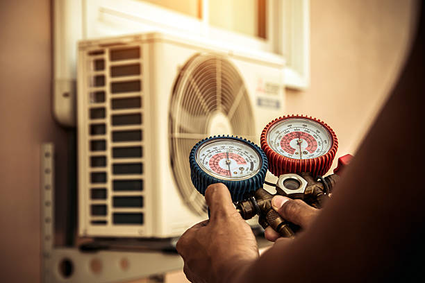 Professional Heat Pump Repair technician working in Dedham, MA